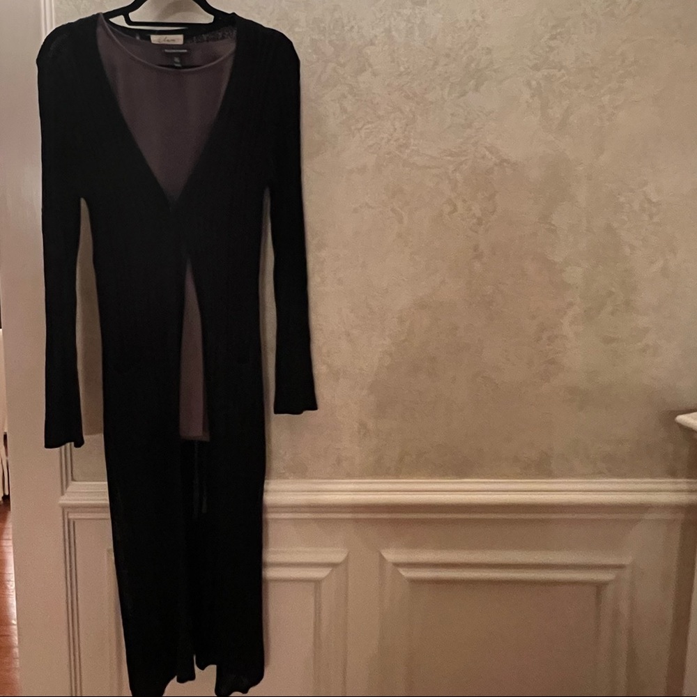 Long black acrylic duster with button and split hem